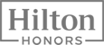 The image shows the logo for Hilton Honors, a loyalty program of the Hilton hotel chain.