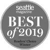 The image shows a gray circular badge with the text "seattle magazine BEST of 2019 Readers' Choice Winner."