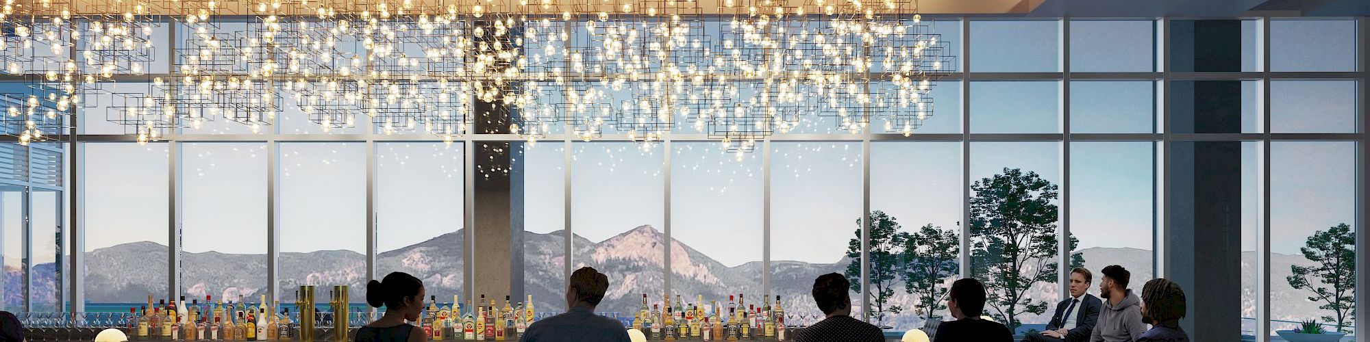 A modern bar with people seated on stools, a scenic view of mountains and trees through large windows, and stylish hanging lights above the counter.